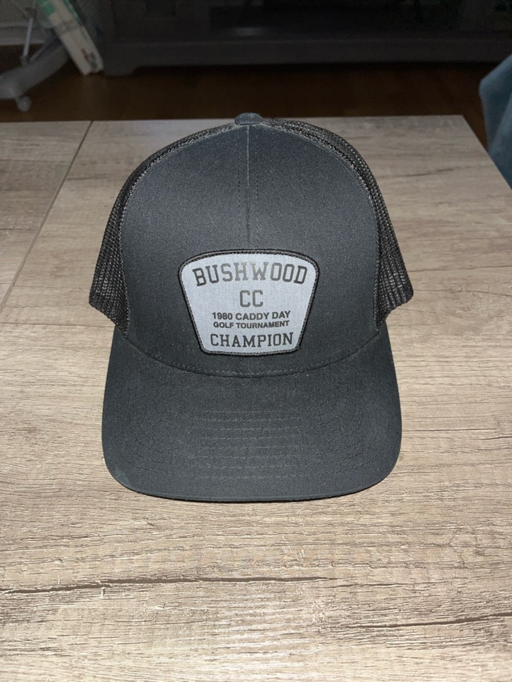 Travis Matthew Bushwood CC Champion Patch Trucker Hat - Black